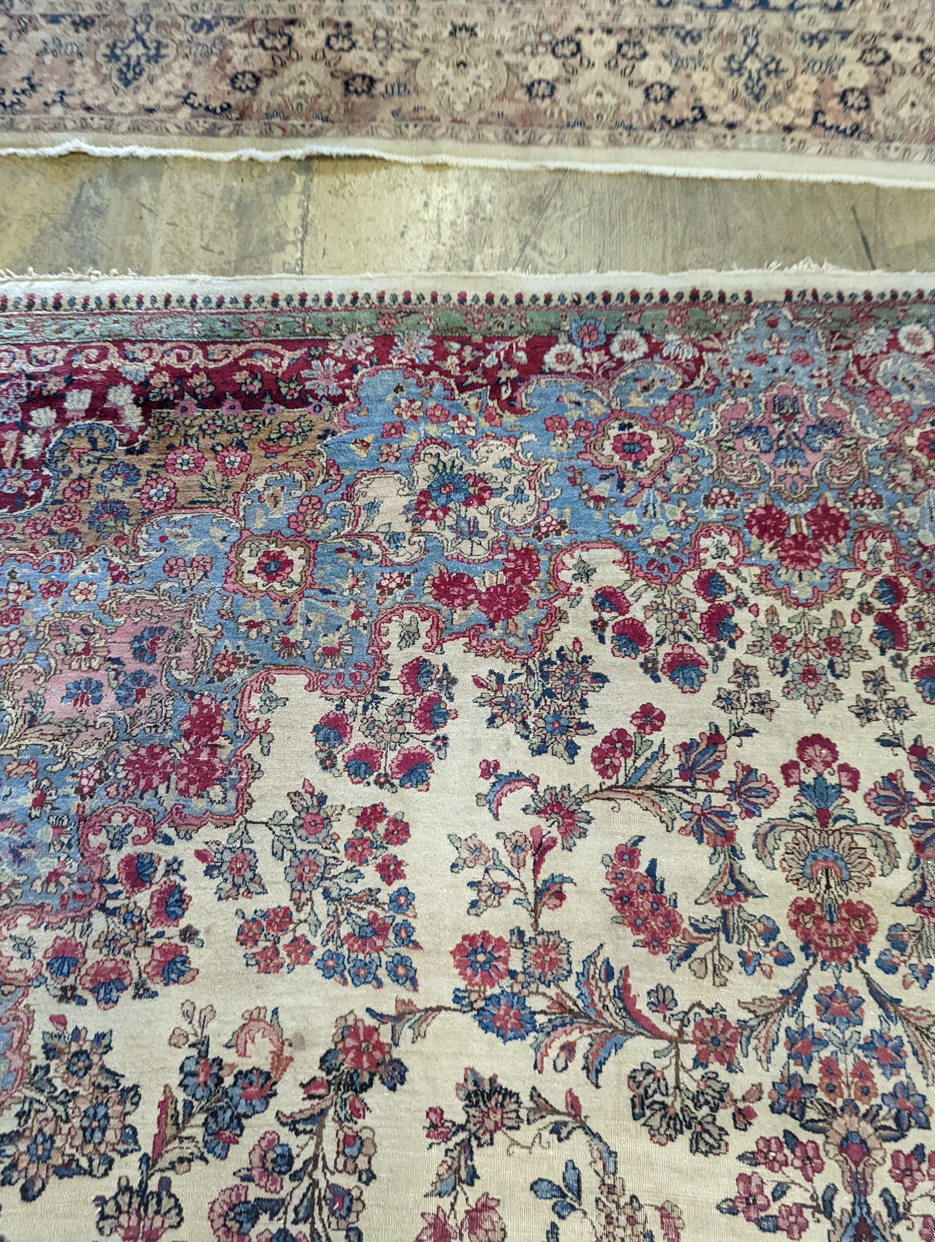 A North West Persian ivory ground carpet, 396 x 290cm